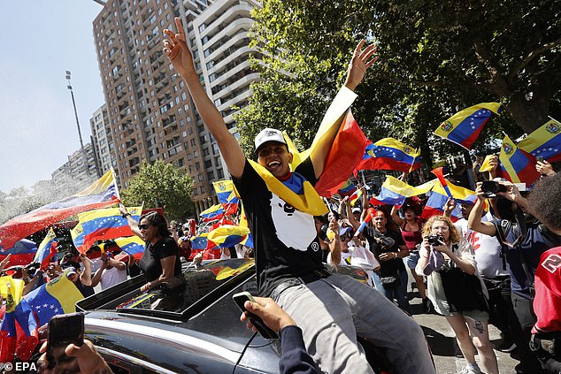 Venezuelans living in Chile celebrate the capture of President Nicolas Maduro in Santiago on Saturday