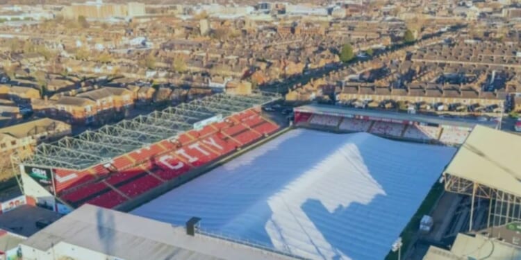EFL forced to step in as 11,000-capacity stadium's pitch is covered by giant TENT