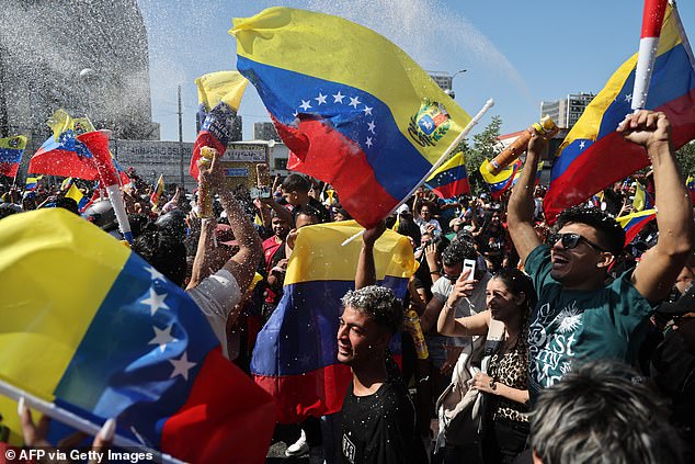 Venezuelans living in Chile celebrate the capture of Nicolas Maduro in Santiago on January 3