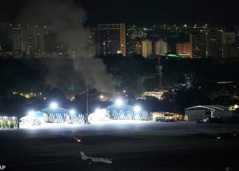 Smoke rises from La Carlota Airport in Caracas, Venezuela, after a daring dead-of-night mission by the US Army's Delta Force unit to capture the country's president Nicolas Maduro on drugs charges