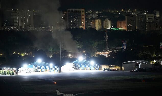 Smoke rises from La Carlota Airport in Caracas, Venezuela, after a daring dead-of-night mission by the US Army's Delta Force unit to capture the country's president Nicolas Maduro on drugs charges