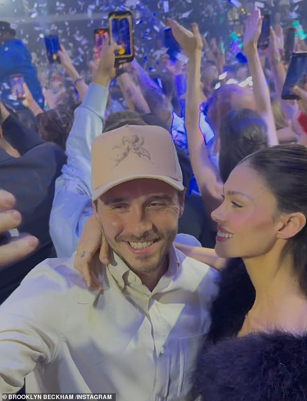 While the distraught former footballer and fashion designer posted photos of Brooklyn on social media, the budding chef seemingly snubbed the olive branch as he watched 50 Cent perform