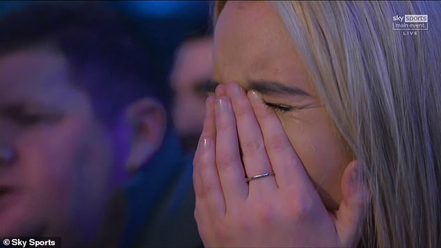 His girlfriend Faith Millar looked emotional after Littler solidified his world No 1 status