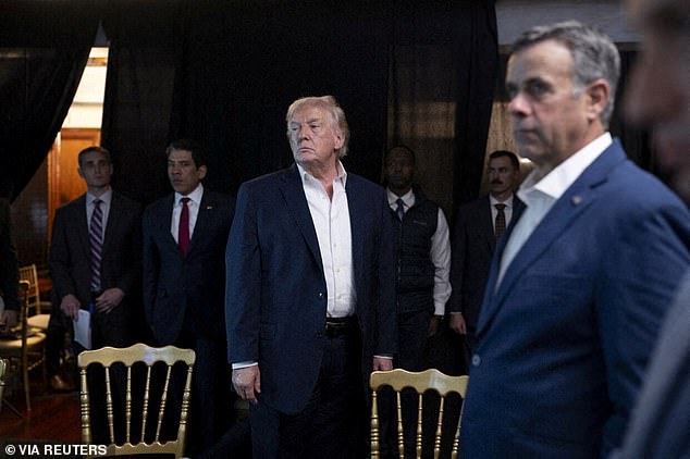 President Donald Trump standing near CIA Director John Ratcliffe as they watch the U.S. military operation in Venezuela