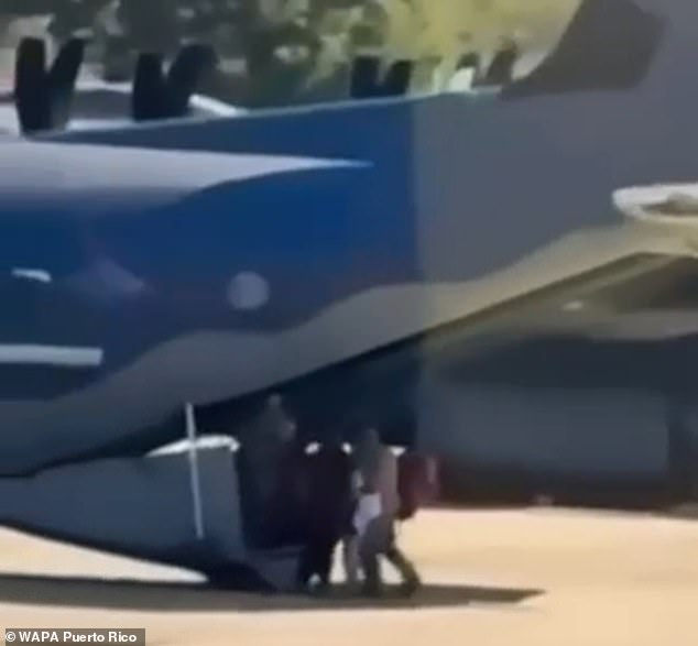 As the shock abduction ordered by Donald Trump sends shockwaves around the world, Puerto Rican broadcaster NotiCentro has shared video allegedly showing Maduro and Flores being escorted onto a US military plane in Aguadilla. A still from the footage is shown above