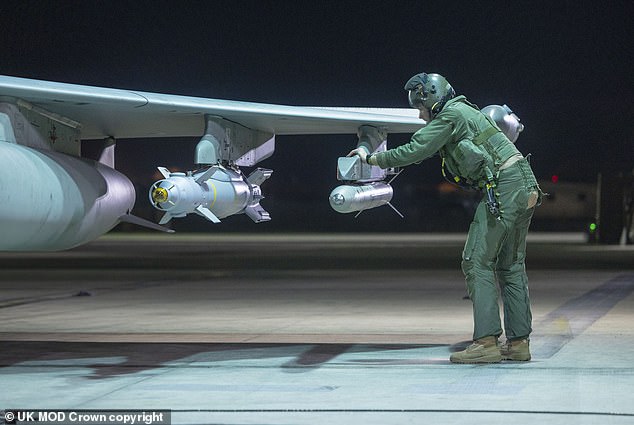 Royal Air Force pilots are seen here preparing Typhoon aircraft before take-off