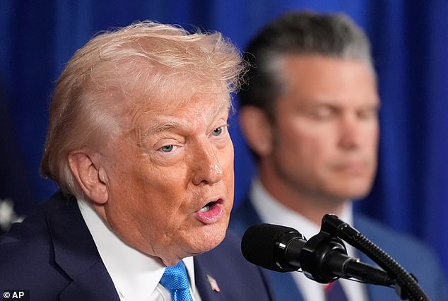 President Donald Trump speaks at his Mar-a-Lago club, Saturday, Jan. 3, 2026, in Palm Beach, Fla., as Defense Secretary Pete Hegseth listens