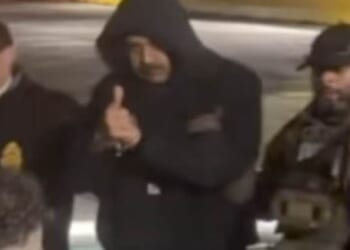 As US officials escorted Venezuelan President Nicolas Maduro out of a cavalcade of white vans, he flashed onlookers a thumbs up