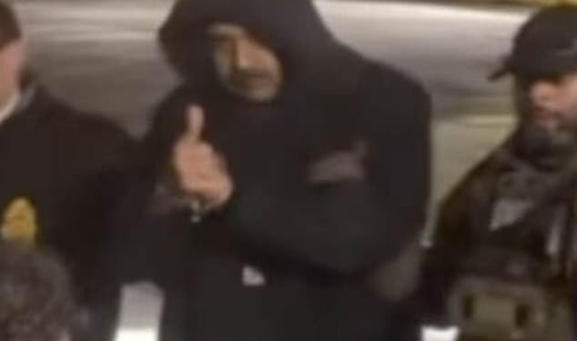 As US officials escorted Venezuelan President Nicolas Maduro out of a cavalcade of white vans, he flashed onlookers a thumbs up