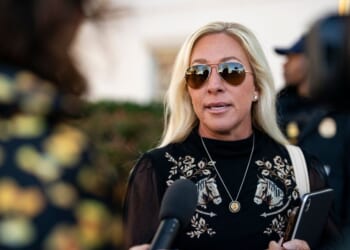 Rep. Marjorie Taylor Greene speaks to reporters while arriving at the Capitol Hill Club for a meeting of the House Republican Conference on March 25, 2025, in Washington, D.C.