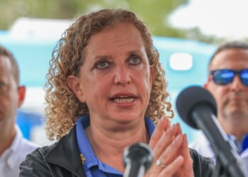 Rep. Debbie Wasserman Schultz, Rep. Jared Moskowitz, and Rep. Darren Soto during a press conference after visiting "Alligator Alcatraz" at the Dade-Collier Training and Transition Airport on July 12, 2025, in Ochopee, Florida.