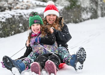 Dozens of schools closed as amber snow warnings hit large parts of UK on return from festive break with up to 3in feared