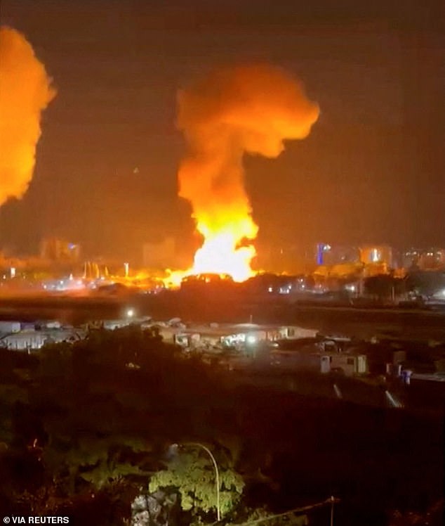 Smoke rises from explosions in Caracas, Venezuela, overnight on Saturday