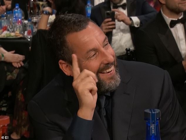 'And the question of the night is who put a neckerchief on Adam Sandler? That person deserves a Critics' Choice award of their own,' she said of the actor's recent style glow-up