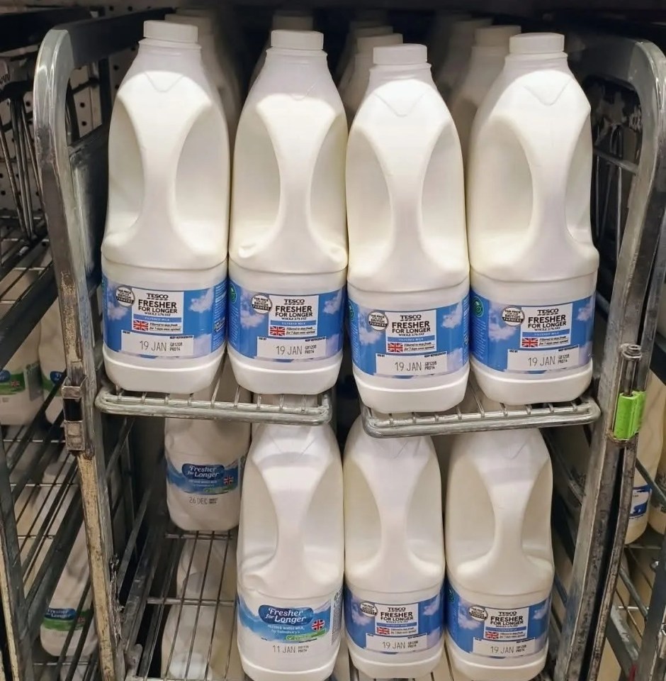 Tesco-branded milk on sale in a Sainsbury's store.