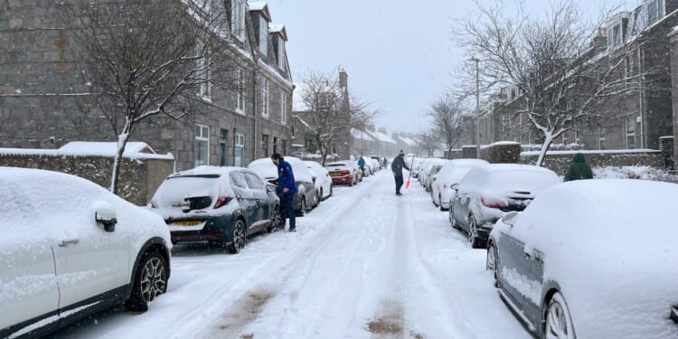 Schools CLOSED as UK plastered with snow & ice warnings and up to 12INCHES to fall on first day back after Xmas holidays