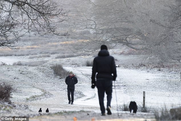 LONDON -- People walk in Richmond Park surrounded by heavy frost at dawn, January 4, 2026