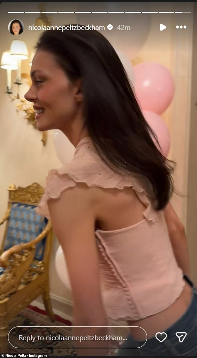 The actress cut a casual but stylish figure in a cropped pink sparkly top and jeans