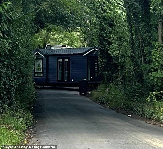 A mobile home is seen before it was installed at the site. Locals claim they blocked the roads