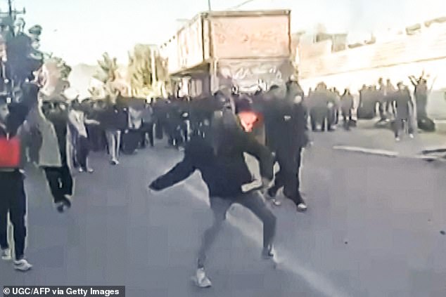 This grab taken on January 2, 2026, from UGC images posted on social media on December 31, 2025, shows protestors attacking a government building in Fasa, in southern Iran on December 31, amidst spontaneous nationwide protests driven by dissatisfaction at the country's economic stagnation