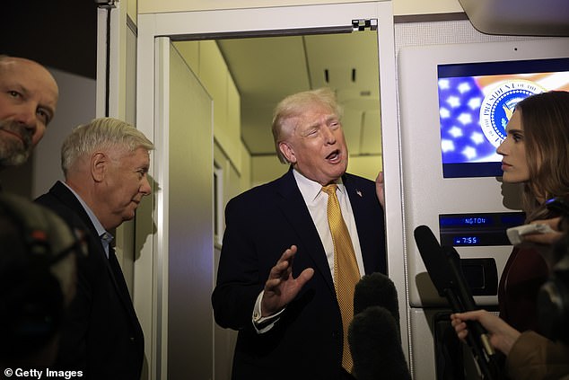 But the PM has refused to criticise the move as he tries to avoid angering Mr Trump (pictured centre), merely saying he was not 'shedding tears' for the ousting of Maduro