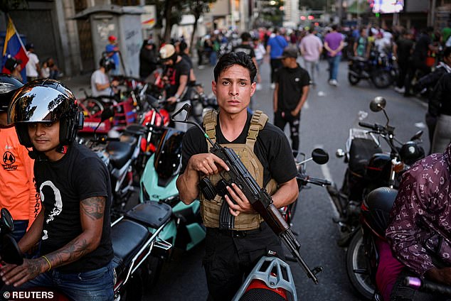 Delcy Rodriguez has ordered her feared secret police to 'search and capture' any so-called collaborators. Pictured: A gunman in Caracas