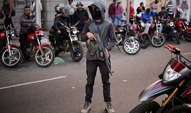 Plain-clothed gunmen were seen patrolling the streets of the capital, Caracas, calling for the release of Venezuela's President Nicolas Maduro