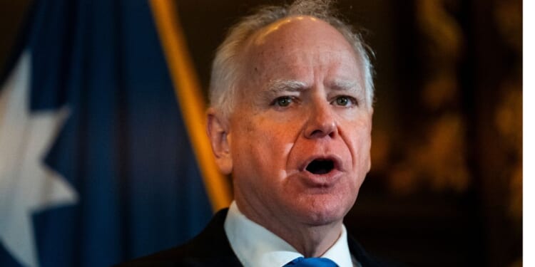 Minnesota Gov. Tim Walz speaks Monday during a press conference at the State Capitol building in St. Paul, Minnesota. Walz announced that he is abandoning his re-election campaign for governor, blaming scrutiny from President Donald Trump for his decision.