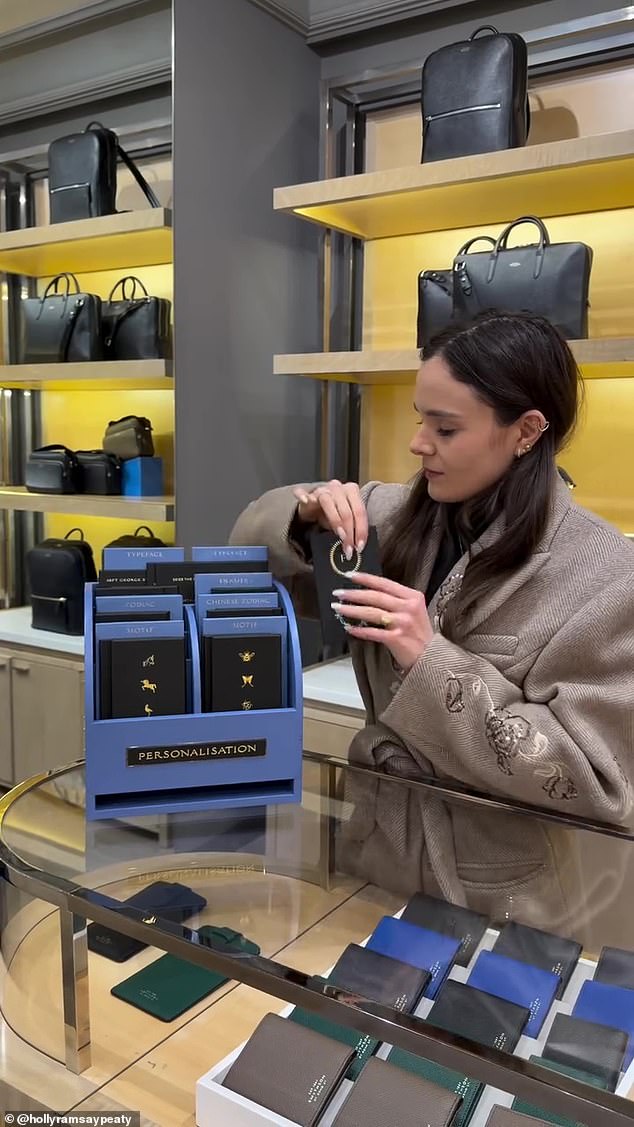 Holly seemed to be enjoying her photoshoot inside the upmarket stationery store