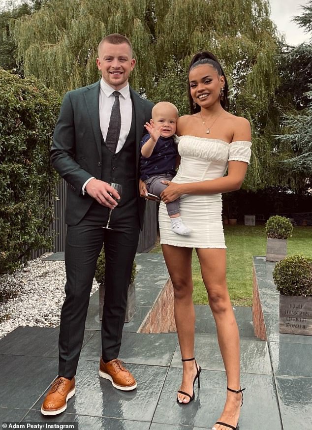 Adam is pictured with ex Eirianned Munro and son George