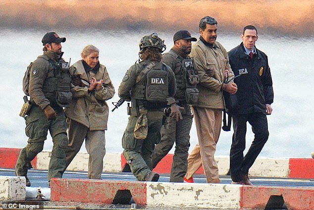 Nicolás Maduro and his wife, Cilia Flores, are seen in handcuffs after landing at a Manhattan helipad as they make their way to a Federal courthouse in Manhattan on January 5, 2026