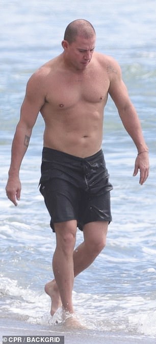 He showcased his impressive physique during the beach outing