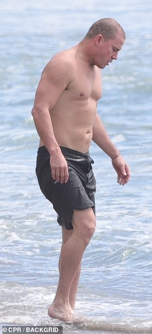 He showcased his impressive physique during the beach outing