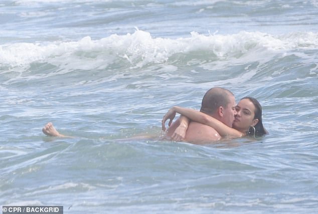 The flirty beach outing comes after a year that has seen the couple steadily step further into the public eye