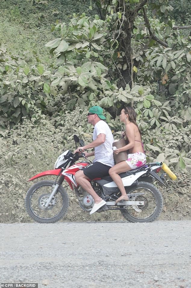 Williams tucked their beach bag in between them as they rode off