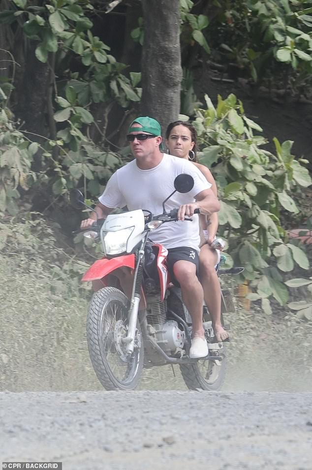 At the end of the sun-soaked beach day, the happy couple hopped on a red motorbike together and drove off to enjoy the rest of their day on the romantic getaway