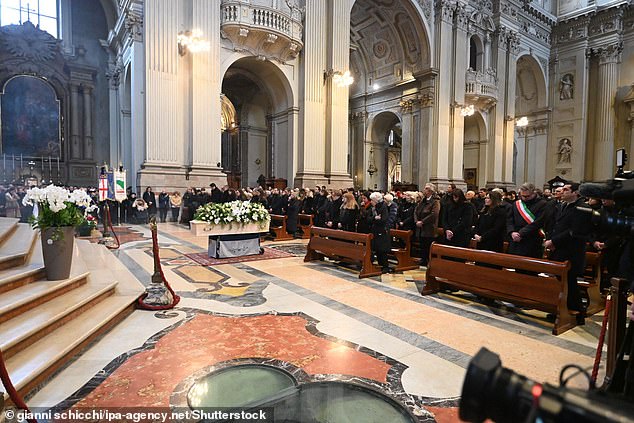 Mourners attending the funeral service of 16-year-old Giovanni in Bologna