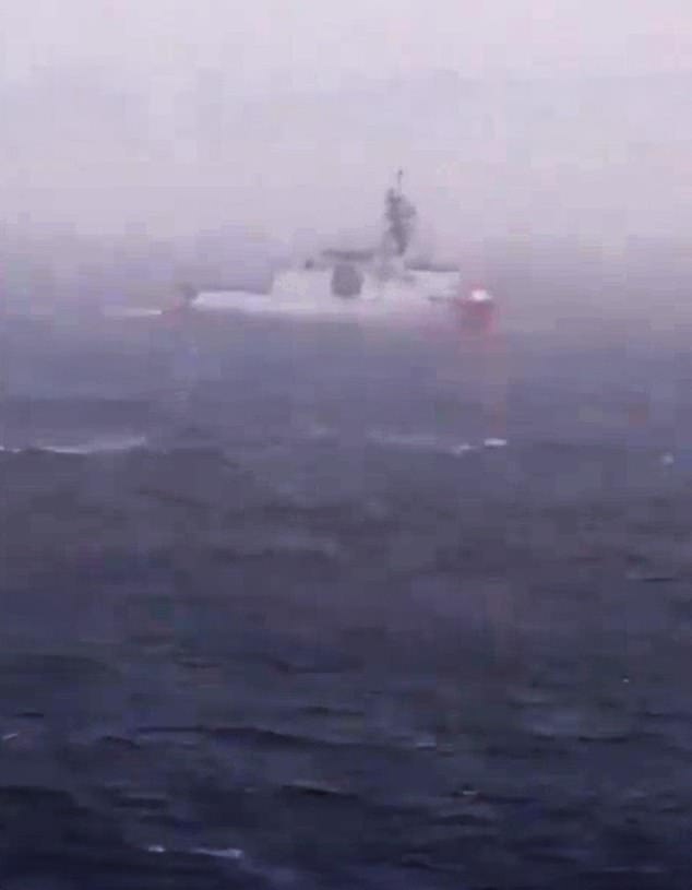 Footage posted by Russian television network RT purports to show a US Coast Guard cutter chasing the Russian-flagged oil tanker