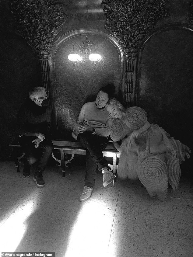 Ariana also posted a snap of herself resting her head on the shoulder over the director