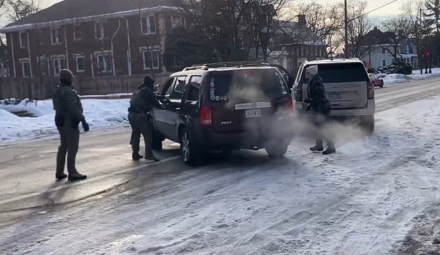 Video of the shooting showed her reverse to head back down the road as an agent tried to open its driver-side door handle before she drove off. Three shots then rang out