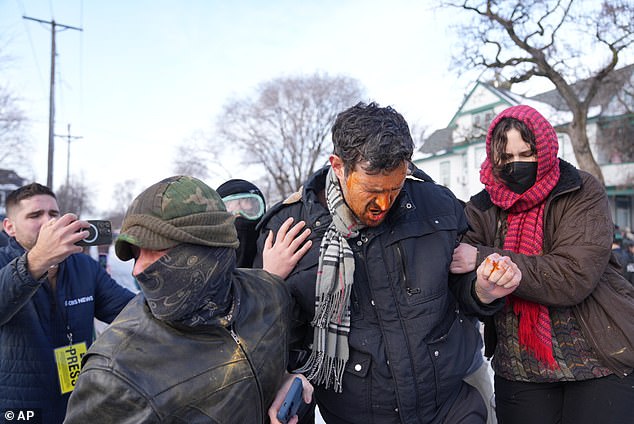 Law enforcement used tear gas and pepper spray on protesters. One man was seen squeezing his eyes shut after being hit with a chemical spray in Minneapolis