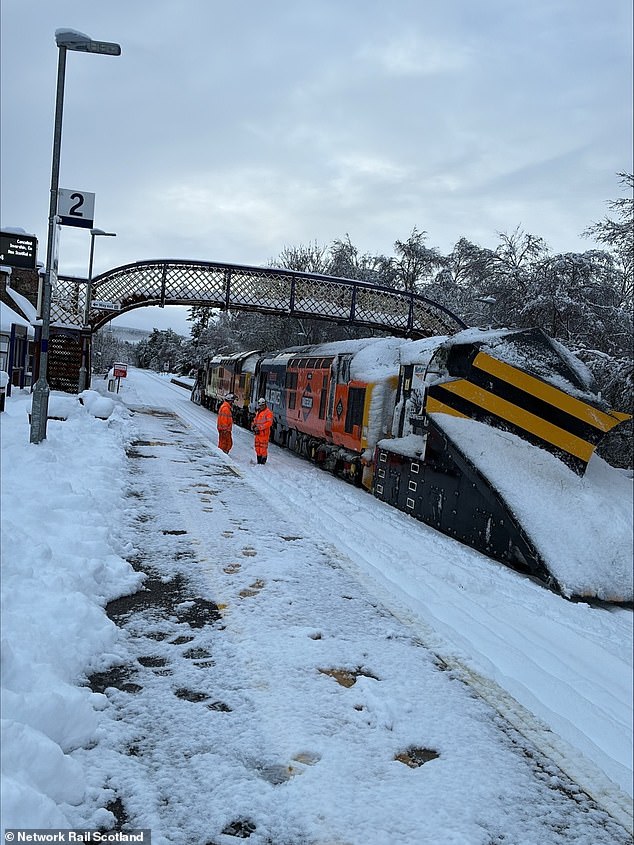 A Network Rail snowplough reaches Lairg station on the Inverness to Wick line this afternoon