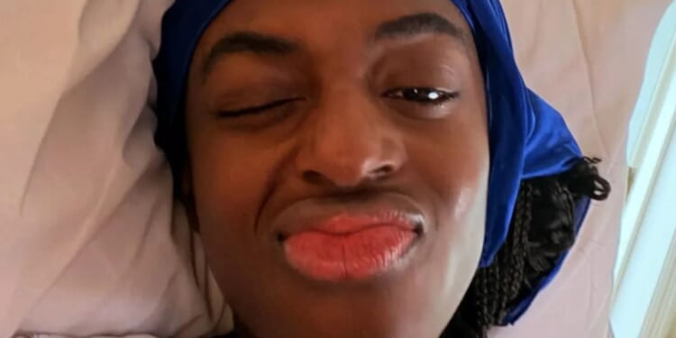 Celeb Traitors' Cat Burns shares hospital photo as she reveals she's had breast reduction surgery after 'years of pain'