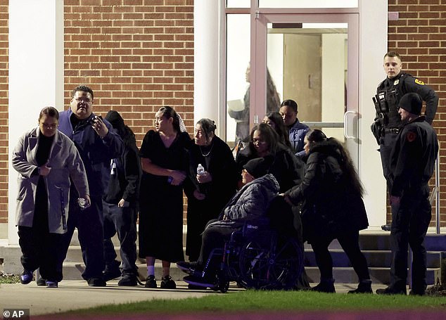 People attending a funeral at the The Church of Jesus Christ of Latter-day Saints in Salt Lake City leave after a fatal shooting in the parking lot