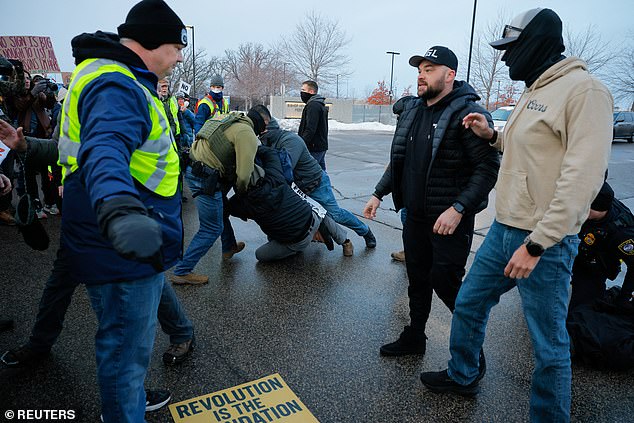 A Border Patrol federal agent helps to detain a demonstrator, at a protest against the fatal shooting of Renee Nicole Good by a U.S. Immigration and Customs Enforcement (ICE) agent, during a rally against increased immigration enforcement across the city, outside the Whipple Building in Minneapolis, Minnesota, U.S., January 8, 2026. REUTERS/Brian Snyder