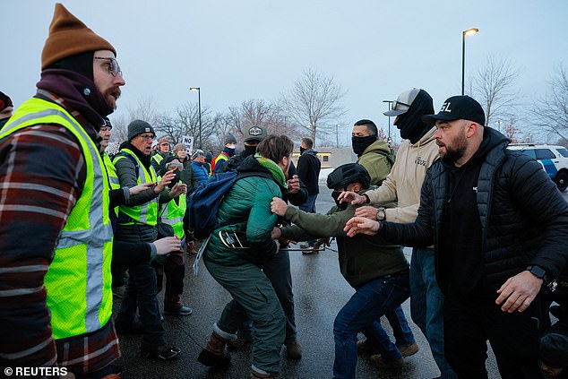 A federal agent detains a demonstrator, at a protest against the fatal shooting of Renee Nicole Good by a U.S. Immigration and Customs Enforcement (ICE) agent, during a rally against increased immigration enforcement across the city, outside the Whipple Building in Minneapolis, Minnesota, U.S., January 8, 2026. REUTERS/Brian Snyder