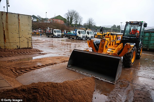 Caerphilly County Borough Council employees prepare equipment to salt the roads today