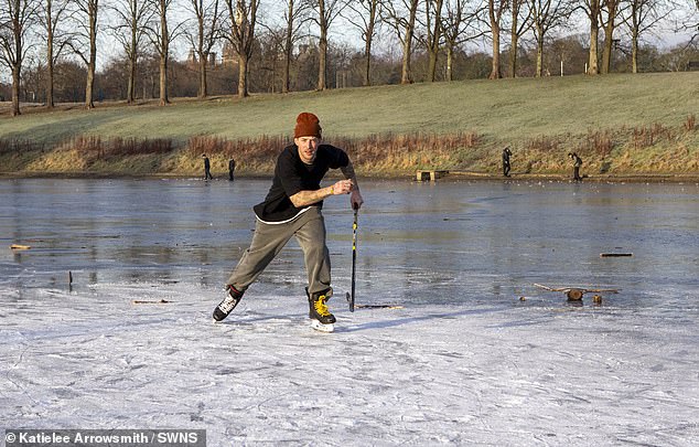 Ice skaters make the most of the cold on a frozen pond at Inverleith Park in Edinburgh today