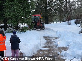 A tractor clears snow in the Aberdeenshire village of Alford yesterday