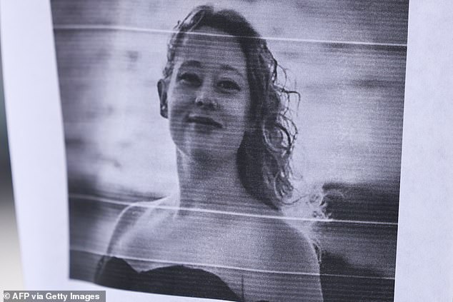 A picture of Renee Nicole Good is displayed near a makeshift memorial